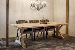 Wooden dining table under the chandelier