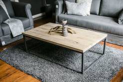 Coffee table between grey seating