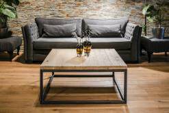 Wooden coffee table with a black frame