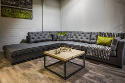Coffee table in front of a grey corner sofa