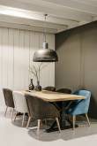 Wooden table with chairs and metal light