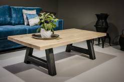 Coffee table in front of a blue sofa