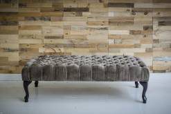 Grey Chesterfield bench with button tufting