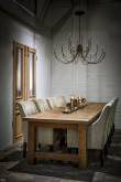 Solid wooden table in a loft setting
