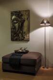 Brown upholstered footstool as a calm living accent